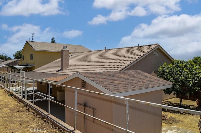 856 Liam Way, Beaumont, CA 92223 - view of side of property with a tile roof and a chimney