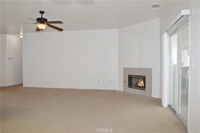 856 Liam Way, Beaumont, CA 92223 - unfurnished living room featuring light colored carpet, a tile fireplace, and ceiling fan