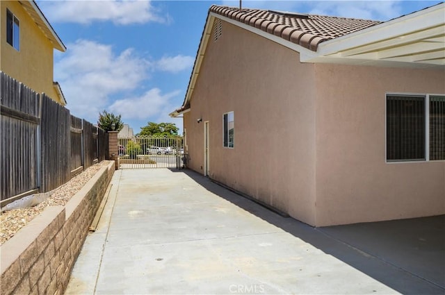 856 Liam Way, Beaumont, CA 92223 - view of side of home with a tile roof and stucco siding