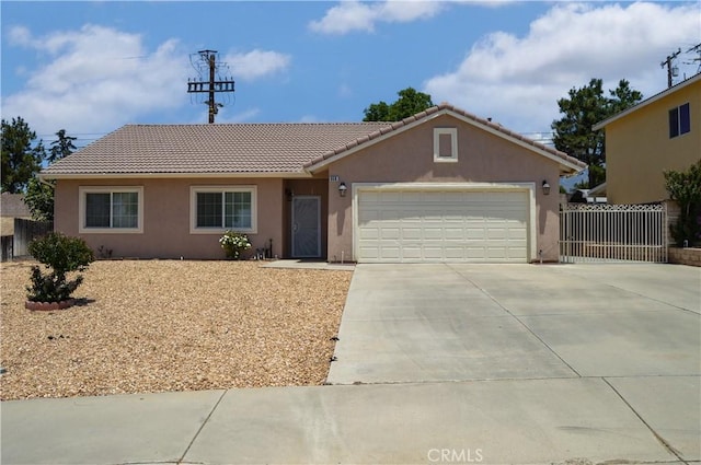 856 Liam Way, Beaumont, CA 92223 - ranch-style house featuring stucco siding, a tiled roof, driveway, and an attached garage