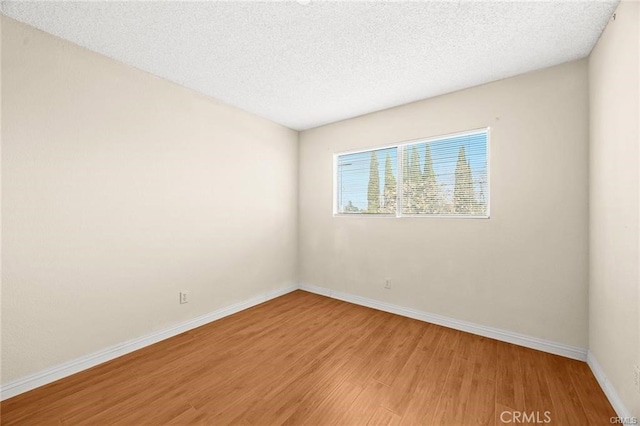 11331 Elliott Ave Unit 21, El Monte, CA 91732 - empty room featuring light wood-style floors and a textured ceiling
