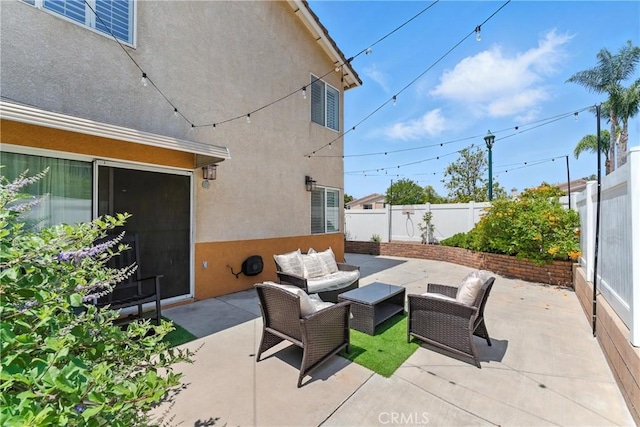 19121 Broken Bow Dr, Riverside, CA 92508 - fenced backyard featuring an outdoor hangout area and a patio area