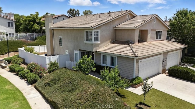 19121 Broken Bow Dr, Riverside, CA 92508 - view of front of home with concrete driveway, a tiled roof, and stucco siding
