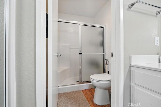 19121 Broken Bow Dr, Riverside, CA 92508 - bathroom with a shower stall, vanity, and wood finished floors