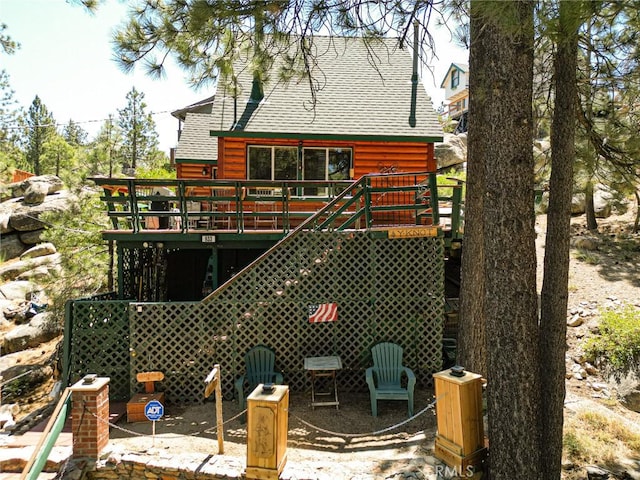 833 Brier Trl, Big Bear Lake, CA 92315 - back of house featuring roof with shingles, a wooden deck, and stairway