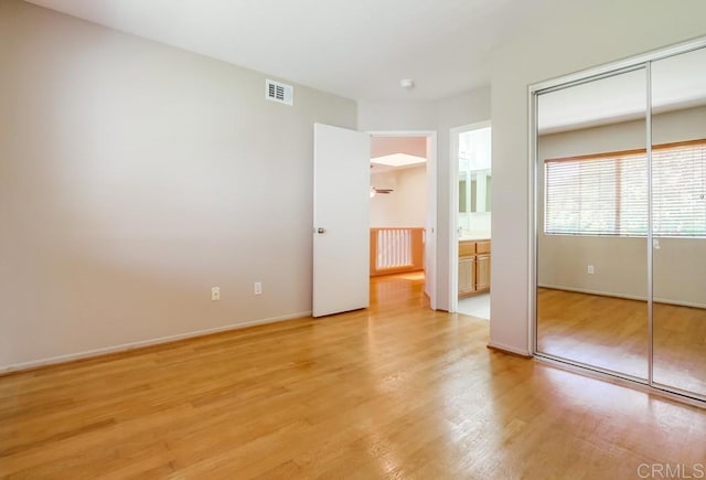 4620 Los Alamos Way Unit C, Oceanside, CA 92057 - unfurnished bedroom with light wood-type flooring and baseboards