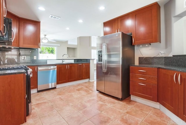 4620 Los Alamos Way Unit C, Oceanside, CA 92057 - kitchen with stainless steel appliances, recessed lighting, ceiling fan, brown cabinetry, and decorative backsplash