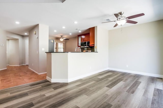 4620 Los Alamos Way Unit C, Oceanside, CA 92057 - unfurnished living room featuring a ceiling fan, recessed lighting, and light wood-style floors