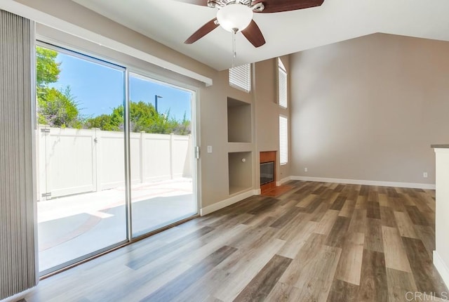 4620 Los Alamos Way Unit C, Oceanside, CA 92057 - unfurnished living room featuring plenty of natural light, wood finished floors, and ceiling fan