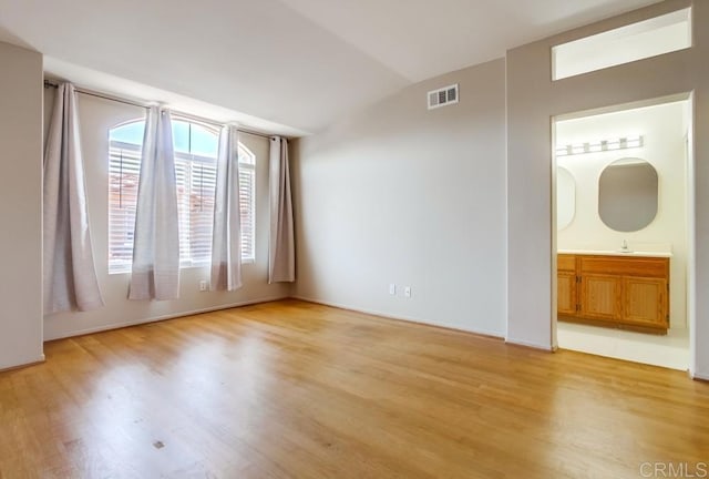4620 Los Alamos Way Unit C, Oceanside, CA 92057 - unfurnished room with light wood-type flooring and vaulted ceiling