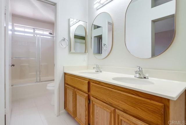4620 Los Alamos Way Unit C, Oceanside, CA 92057 - full bathroom featuring double vanity, bath / shower combo with glass door, and tile patterned floors