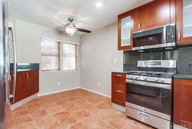 4620 Los Alamos Way Unit C, Oceanside, CA 92057 - kitchen with stainless steel appliances, ceiling fan, tasteful backsplash, glass insert cabinets, and brown cabinetry