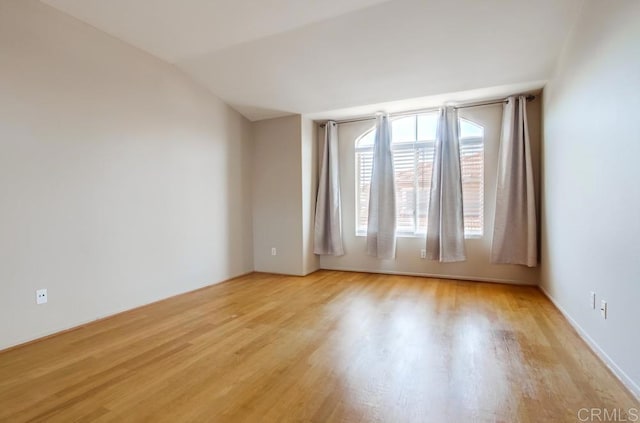 4620 Los Alamos Way Unit C, Oceanside, CA 92057 - empty room featuring light wood-type flooring and vaulted ceiling