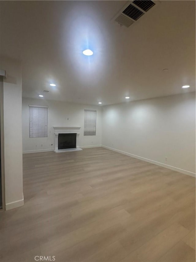 4974 S Rosemary Way, Ontario, CA 91762 - unfurnished living room featuring recessed lighting, light wood-style flooring, and a fireplace with raised hearth