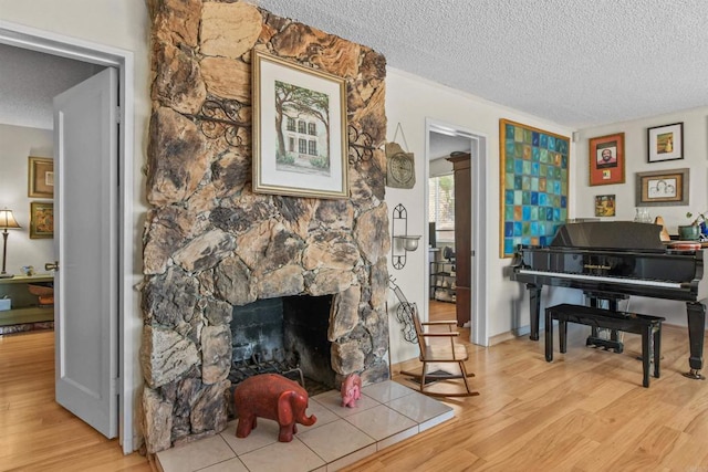 3135 S Bonita St, Spring Valley, CA 91977 - sitting room with wood finished floors, a textured ceiling, and a fireplace