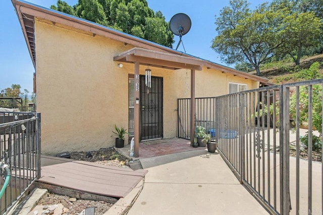 3135 S Bonita St, Spring Valley, CA 91977 - property entrance featuring stucco siding and a gate