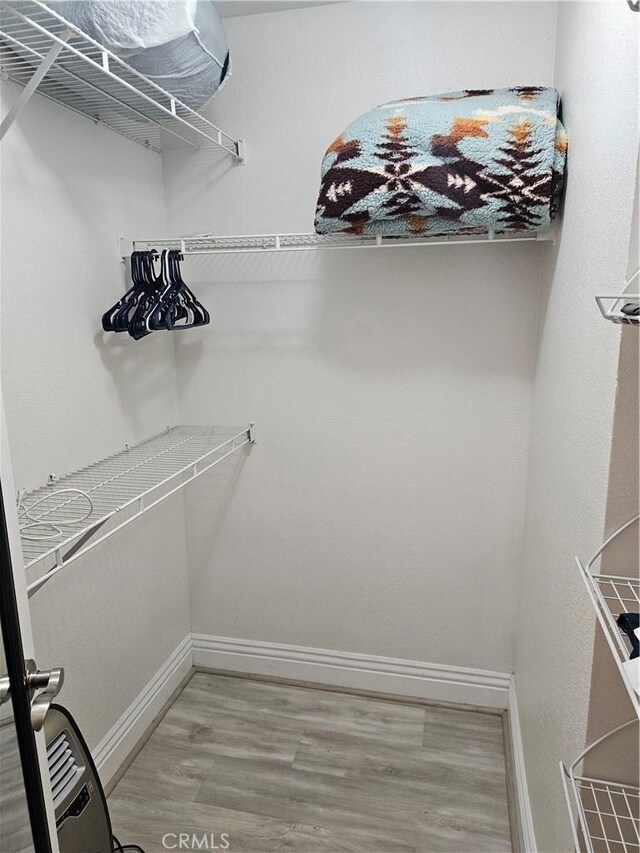 2350 Del Mar Way Unit 103, Corona, CA 92882 - spacious closet featuring wood finished floors
