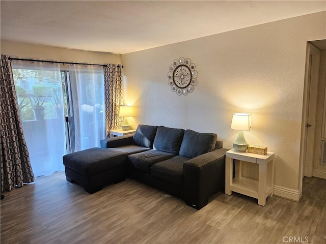 2350 Del Mar Way Unit 103, Corona, CA 92882 - living area featuring wood finished floors and baseboards