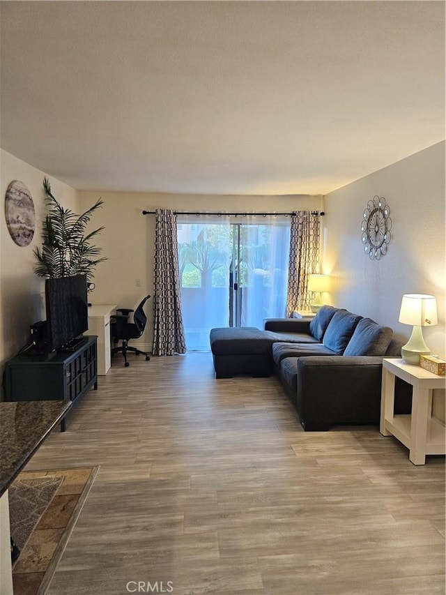 2350 Del Mar Way Unit 103, Corona, CA 92882 - living area featuring light wood-type flooring and a desk