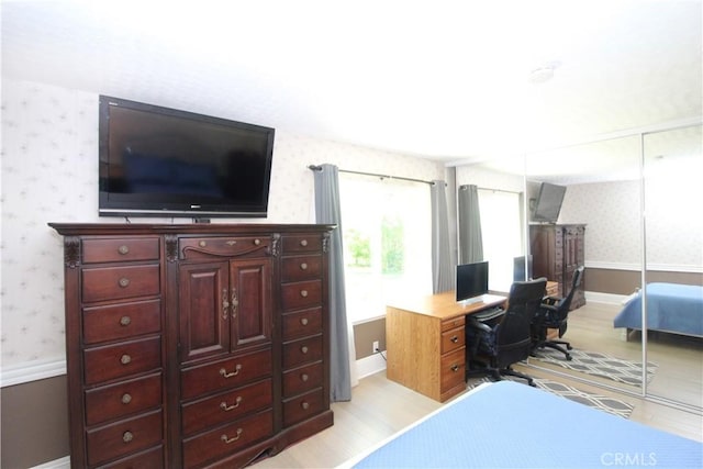23281 Via Bahia, Mission Viejo, CA 92691 - bedroom featuring wallpapered walls, light wood-style flooring, a closet, and an office area