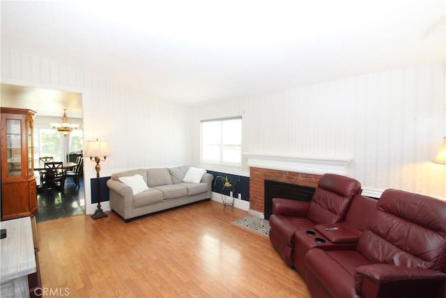 23281 Via Bahia, Mission Viejo, CA 92691 - living room with wallpapered walls, wood finished floors, and a brick fireplace