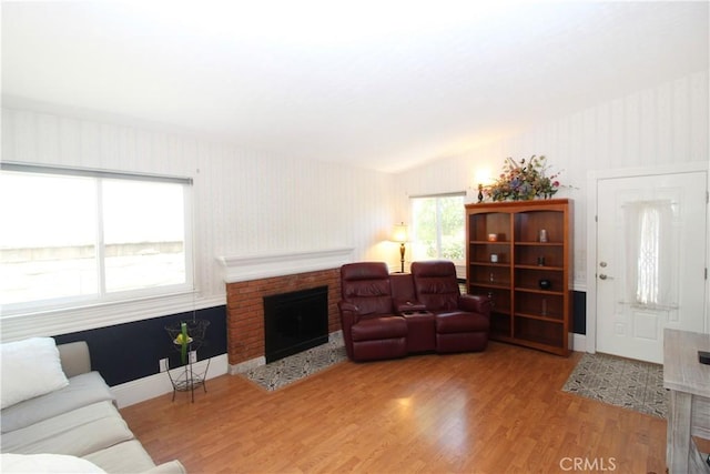 23281 Via Bahia, Mission Viejo, CA 92691 - living area with a brick fireplace, wood finished floors, and wallpapered walls