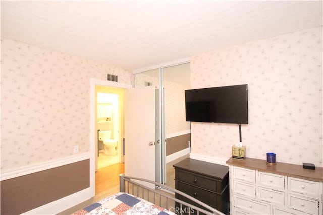 23281 Via Bahia, Mission Viejo, CA 92691 - bedroom with light wood-style floors and wallpapered walls