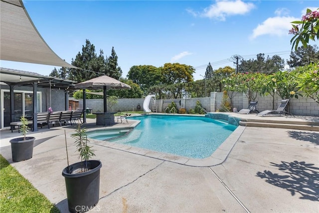 2951 S Plainfield Pl, Ontario, CA 91761 - view of swimming pool with a water slide, a patio, a fenced backyard, and a pool with connected hot tub