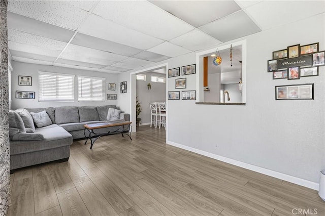 2951 S Plainfield Pl, Ontario, CA 91761 - living area featuring a paneled ceiling and wood finished floors