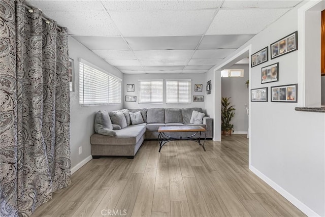 2951 S Plainfield Pl, Ontario, CA 91761 - living area with a drop ceiling and light wood-style floors