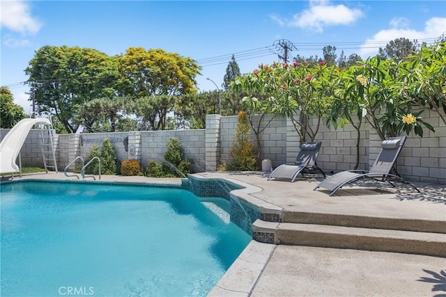 2951 S Plainfield Pl, Ontario, CA 91761 - view of swimming pool with a water slide, a fenced backyard, and a patio