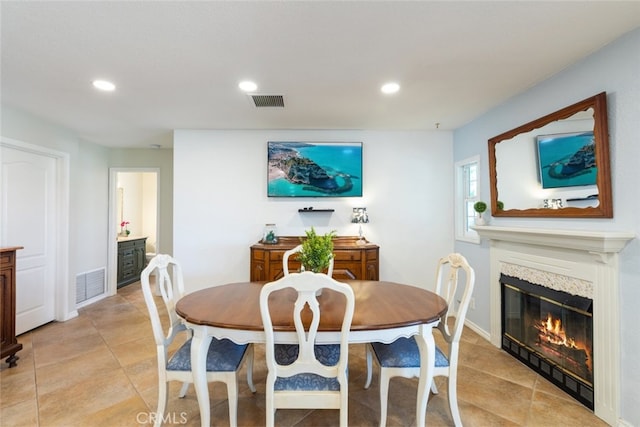 1225 Old Hickory Rd, Corona, CA 92882 - dining room with recessed lighting, a glass covered fireplace, and light tile patterned floors