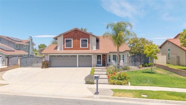 1225 Old Hickory Rd, Corona, CA 92882 - traditional-style house featuring a garage, a gate, concrete driveway, stone siding, and a tiled roof