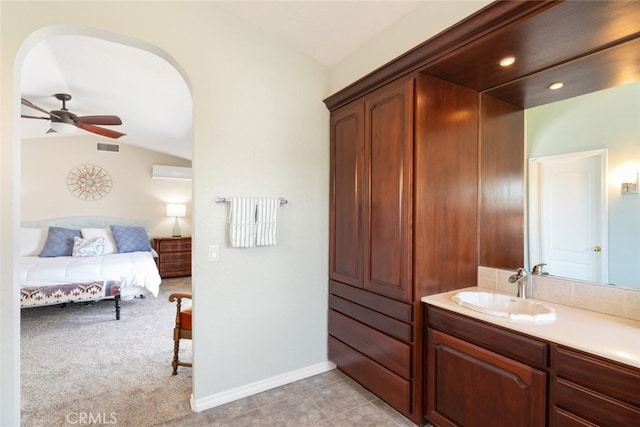 1225 Old Hickory Rd, Corona, CA 92882 - ensuite bathroom with vaulted ceiling, vanity, a wall mounted air conditioner, and a ceiling fan