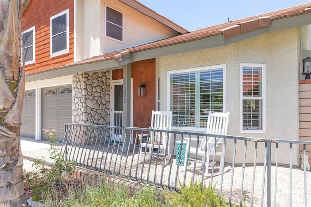 1225 Old Hickory Rd, Corona, CA 92882 - view of front of house with a garage, stucco siding, a porch, and driveway
