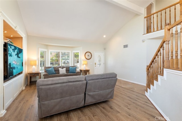 1225 Old Hickory Rd, Corona, CA 92882 - living room with high vaulted ceiling, wood finished floors, stairway, beamed ceiling, and recessed lighting