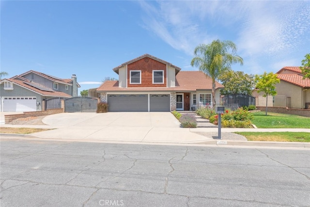 1225 Old Hickory Rd, Corona, CA 92882 - traditional-style home with a gate, an attached garage, concrete driveway, stone siding, and a porch