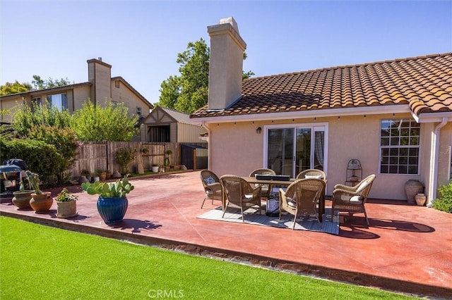 215 Meadowlark Rd, Paso Robles, CA 93446 - back of house featuring a tiled roof, a patio area, a chimney, and stucco siding