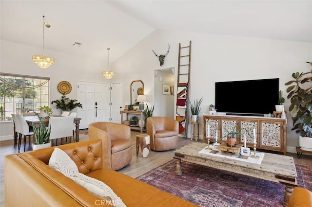 215 Meadowlark Rd, Paso Robles, CA 93446 - living room featuring wood finished floors, a chandelier, and high vaulted ceiling