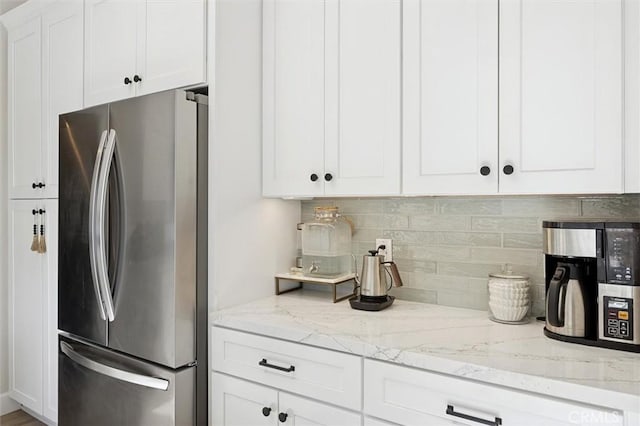 215 Meadowlark Rd, Paso Robles, CA 93446 - kitchen with freestanding refrigerator, backsplash, white cabinets, and light stone countertops