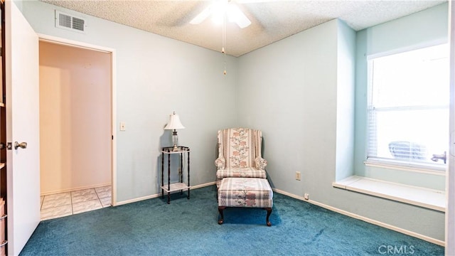7339 Greenbriar Pl, Rancho Cucamonga, CA 91730 - sitting room featuring ceiling fan, a textured ceiling, and carpet