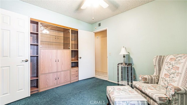 7339 Greenbriar Pl, Rancho Cucamonga, CA 91730 - living area with carpet flooring, a textured ceiling, and ceiling fan