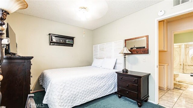 7339 Greenbriar Pl, Rancho Cucamonga, CA 91730 - carpeted bedroom with ensuite bathroom and a textured ceiling
