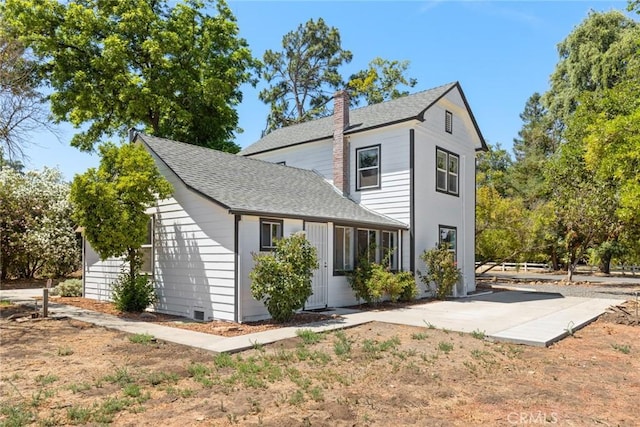 2725 W Sacramento Ave, Chico, CA 95973 - view of front of house featuring a chimney, a shingled roof, and a patio area
