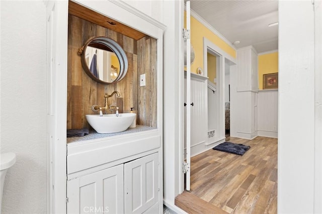2725 W Sacramento Ave, Chico, CA 95973 - bathroom with wood finished floors, vanity, and ornamental molding