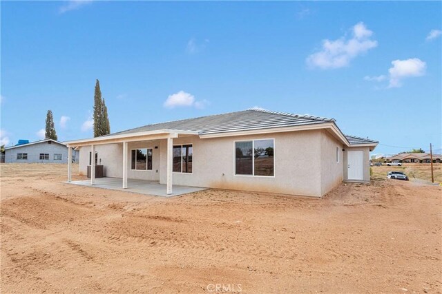 18420 Wisteria St, Hesperia, CA 92345 - back of property with stucco siding, a patio, and a tiled roof