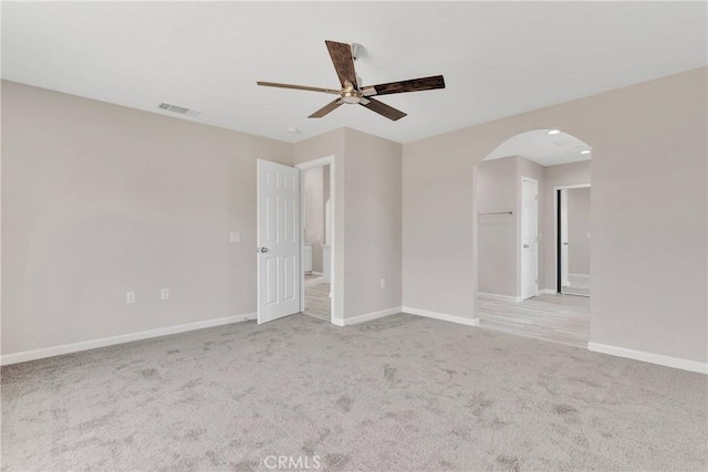 18420 Wisteria St, Hesperia, CA 92345 - spare room featuring arched walkways, ceiling fan, and carpet
