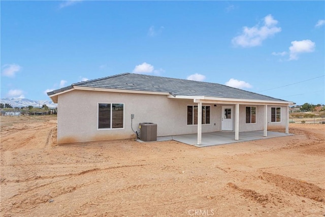 18420 Wisteria St, Hesperia, CA 92345 - rear view of house featuring stucco siding, a patio, and a mountain view