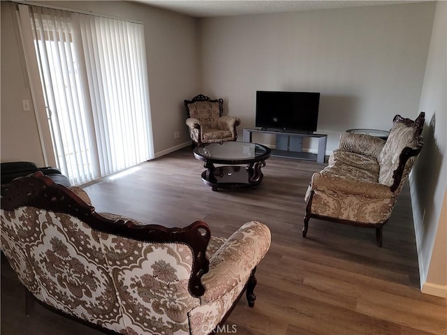 15420 Apache Rd, Apple Valley, CA 92307 - living area with wood finished floors and healthy amount of natural light