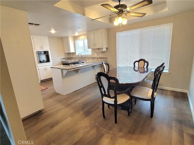 15420 Apache Rd, Apple Valley, CA 92307 - dining space with dark wood-style flooring and ceiling fan